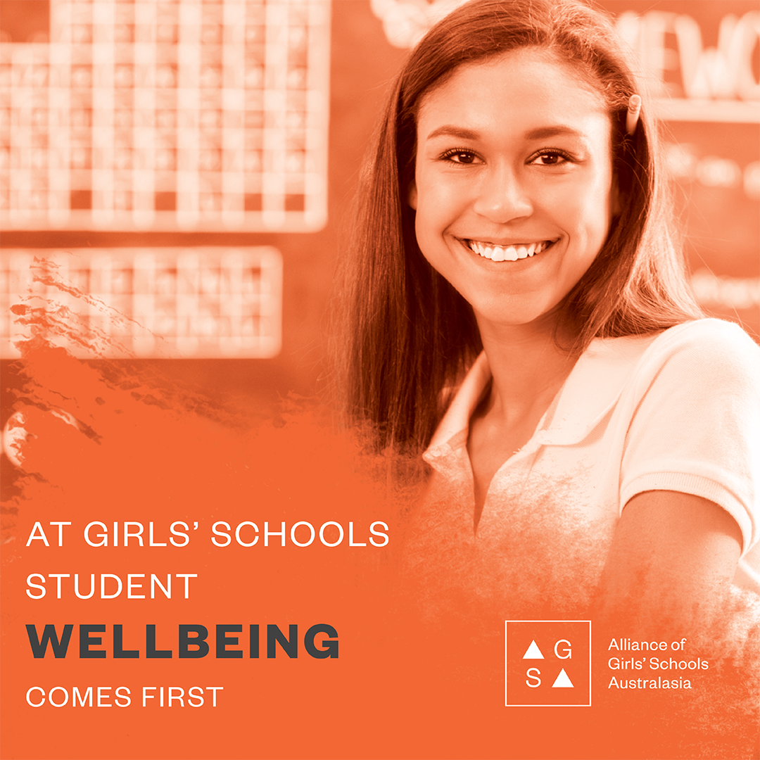 Smiling student with text stating student wellbeing comes first at girls’ schools
