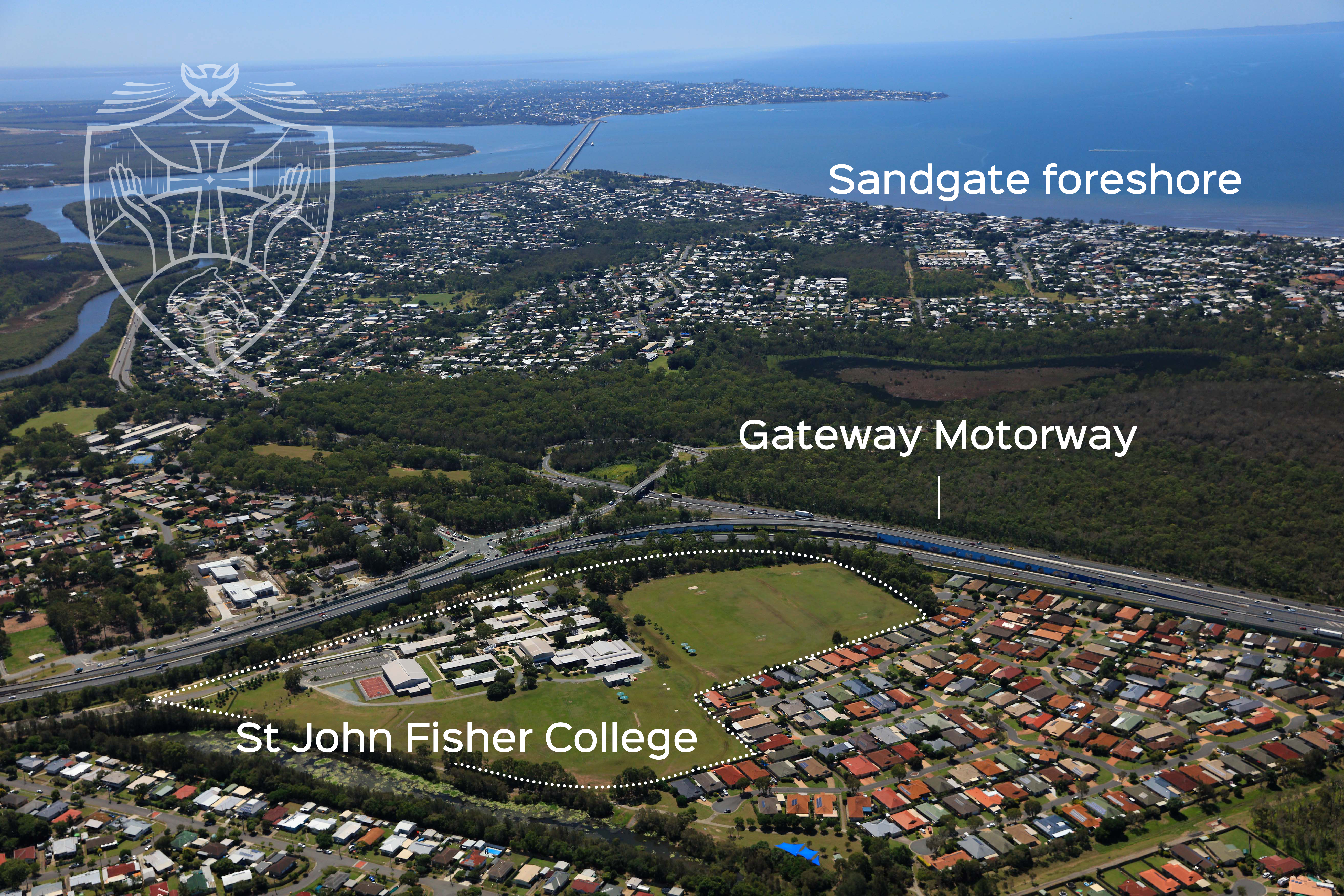 Aerial view of St John Fisher College campus with surrounding suburbs, Gateway Motorway and Sandgate foreshore labelled